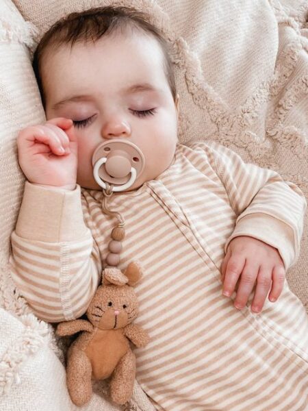 fodla asleeping wearing natural organic cotton baby romper