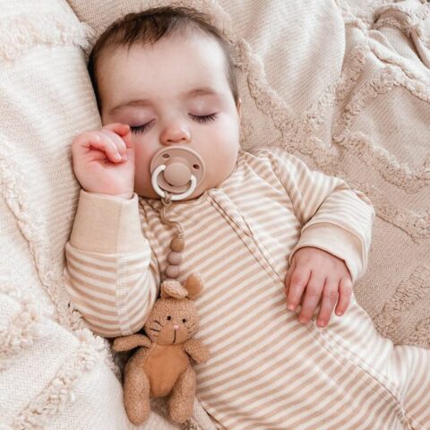 fodla asleeping wearing natural organic cotton baby romper