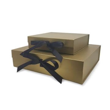 gold gift box with black ribbon