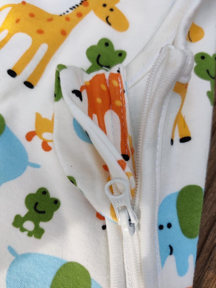 picture of organic cotton baby sleeping bag with animals print. picture of the zip