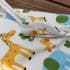 picture of organic cotton baby sleeping bag with animals print. picture of the zip