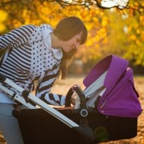 photo of a woman looking her baby